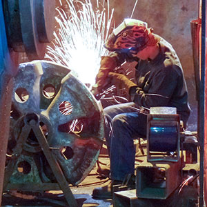Jefferson Machine welder working on an industrial equipment component